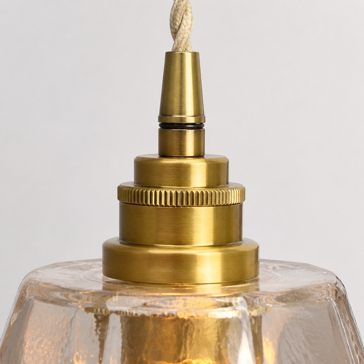 Antique brass lamp holder close-up on faceted glass shade