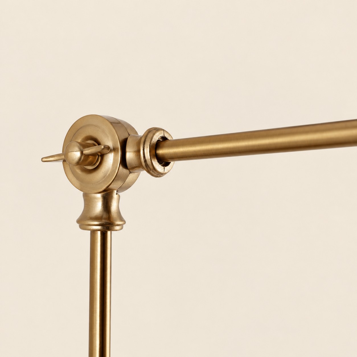 Close view of the gold swing-arm joint